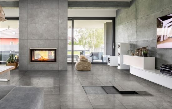 Spacious villa interior with cement wall effect, fireplace and tv